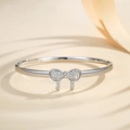Silver bow bangle with sparkling micro-pave crystals on a minimalist thin metal band - Silver