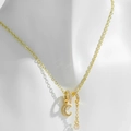 Collar chapado en oro con colgantes de luna y estrella de circón mostrado en maniquí - Oro de 14K (PXL232)