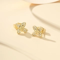 Elegant gold four-leaf flower stud earrings with sparkling pave-set white crystals - 14K Gold