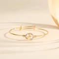 Macro detail of gold adjustable bracelet with sparkling crystal encrusted letter A - Style A