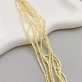 Natural cream shell beads for jewelry making, round strands on white ceramic tray - 2mm Round Bead / Natural