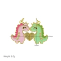 Macro shot of magnetic cartoon dinosaur pendants with gold crown and crystal heart - Dinosaur Heart Pendant Only (Without Chain)