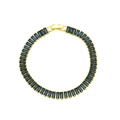 Macro shot of gold plated tennis bracelet featuring emerald cut deep blue zircon stones - Dark Blue Style (DB260106-E)