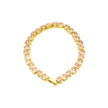 Detailed view of a gold-plated bracelet featuring heart-shaped pink zircon gemstones - Pink