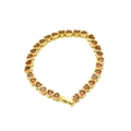 Detail view of a gold-plated bracelet featuring continuous red heart-shaped zircon stones - Red