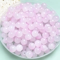 Roze doorschijnende glazen kralen van 8 mm voor DIY sieraden in een heldere tray - 101 stuks / Roze Verloop