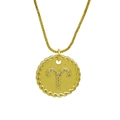 Macro detail of Aries zodiac gold coin necklace with cubic zirconia and twisted rope edge - Aries