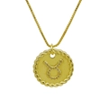 Detail of golden Taurus constellation pendant with twisted rope border and zircon accents - Taurus