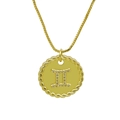 Macro view of gold Gemini pendant with cubic zirconia and twisted rope border - Gemini