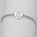 Macro detail of silver heart pendant with letter O and zircon inlay on a curb chain - Silver Letter O