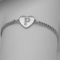 Macro detail of silver heart charm with cubic zirconia letter P on Cuban chain bracelet - Silver Letter P