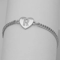 Close-up of heart charm with letter R zircon inlay on silver Cuban link chain - Silver Letter R