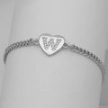 Macro shot of silver heart pendant with pave-set letter W on Cuban chain bracelet - Silver Letter W