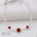 Elegant beaded pearl necklace featuring red lantern beads and golden filigree details - Red Bead Gold Hollow Necklace (DN241215-E)
