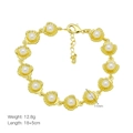 Detailed view of gold scallop shell bracelet with white pearls and lobster clasp closure - Scallop Pearl Style (DB250503-C)