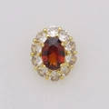 Macro detail of oval red gemstone necklace pendant with halo diamonds in 18k gold plating - January (Pendant Only (Without Chain))