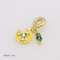 Macro shot of gold lemon pendant with yellow enamel and green leaf charm, 2.8g weight - Lemon Slice Style (DB250703-C)