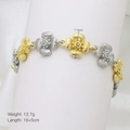 Detailed macro view showing the two-tone flower link bracelet with 11mm floral patterns - Two-tone Gold And Silver Flower Style (DB250805-A)
