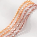 Natuurlijke zoetwaterparels in oranje en paars voor het maken van DIY sieraden - Oranje Rijstvorm (4-5mm)