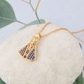 Gold Virgin Mary pendant necklace with blue zircon stones on white pebbles - Virgin Mary Style (NA01-3)