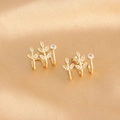 Detailed close-up of 18k gold plated leaf stud earrings with sparkling white zircons - Gold Plated White Zircon Leaf