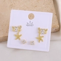 Detailed set of golden crab and starfish stud earrings with crystals on a display card - Crab (EO04-8)