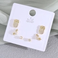 Three-pair gold stud earring set featuring cubic zirconia owls and stars on card - Owl (EO08-3)