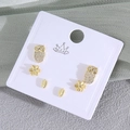 Three-pair gold earring set featuring owl, flower, and leaf designs with sparkling zircons - Owl (EO08-6)