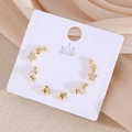 Lot de trois paires de boucles d'oreilles étoiles dorées avec zircons et cristaux - Étoile (EO12-4)