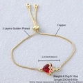 Adjustable gold plated chain bracelet featuring a red heart pendant with cross detail - Gold Plated Cross Sacred Heart (NAA05-5)