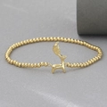 Detailed view of 18k gold plated bracelet with a polished reindeer pendant and round beads - Reindeer Style (NAG07-1)