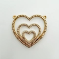 Dreischichtiger goldener Herzanhänger mit Pavé-Kristallen und doppelten Aufhängeschlaufen - Gold Dreifachherz Nesting Doppelring Stil (NA06-2)
