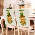 Detail of linen chair covers with St. Patrick's Day cartoon cat and festive text decor - Happy St. Catty's Day Orange Cat (TYTDR119-8)