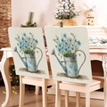 Detail of two floral bunny chair covers on wooden chairs in a cozy home setting - 49*58cm / Metal Kettle Blue Floral Print (TYTDR116-26)