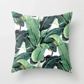 Detail of square cushion cover with green and yellow tropical banana leaf print - Lush Yellow Green Banana Leaf Pattern (DRD7-7)
