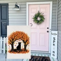 Detailed close-up of burlap garden flag featuring a black cat under autumn maple trees - Black Cat Maple (HYQT51-20)