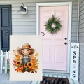 Vertical garden flag with scarecrow and pumpkins hanging on a black metal pole outdoors - Autumn Scarecrow (HYQT51-22)