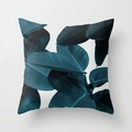 Detail of square pillow featuring dark green tropical plant leaf print on peach skin fabric - 18x18 Inch