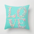 Close-up of turquoise cushion cover featuring sweet pink 3D LOVE letter collage design - Cyan Green Background Marshmallow LOVE Collage Style (DRD212-24) / 18x18 Inch