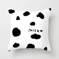 Detail of cow print throw pillow cover with milk text and heart on soft white fabric - Cow Print MILK (DRD334-6) / 18x18 Inch