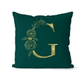 Close-up of luxury dark green velvet pillowcase with gold floral letter G print - 45x45cm / Letter G