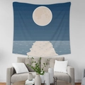 Minimalist moon and ocean waves tapestry hung over a modern grey sofa in a cozy living room - GT35-6