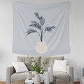 Detail of a blue tropical plant tapestry hanging above a modern living room sofa - GT35-7