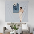 Detailed view of modern illustration tapestry hanging above a sofa in a minimalist room - GT35-8
