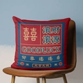 Red festive square pillow cover with Xi character and Good Luck text on leather chair - CRS05-10