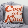 Minimalist peach skin pillow with orange Cool to be Kind print on gray sofa - 45x45 / Cool To Be Kind Orange Design (DRD291-12)