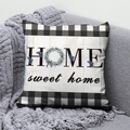 Detail of HOME sweet home printed cushion with blue berry wreath on a grey sofa - 45x45 / Home Sweet Home Wreath Design (DRD291-15)
