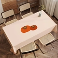 Detailed top-down view of a rectangular persimmon fabric tablecloth on a wooden dining table - Zb08-20 / 40*60cm Small Towel
