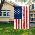 Double-sided burlap garden flag with distressed US flag design in a sunny backyard setting - Vintage America Graphic (HYQ19-6)