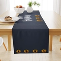 Detail of blue Halloween table runner with Happy Halloween text and pumpkin motifs on wood - 33x183cm / Table Flag